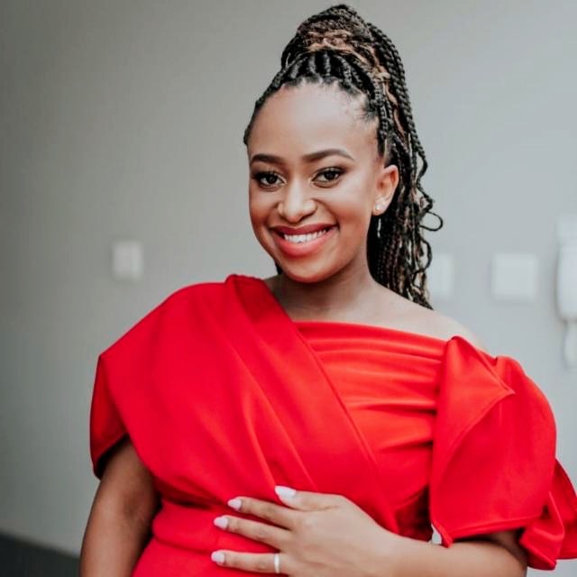 Lerato Mabanga, smiling, in a red dress